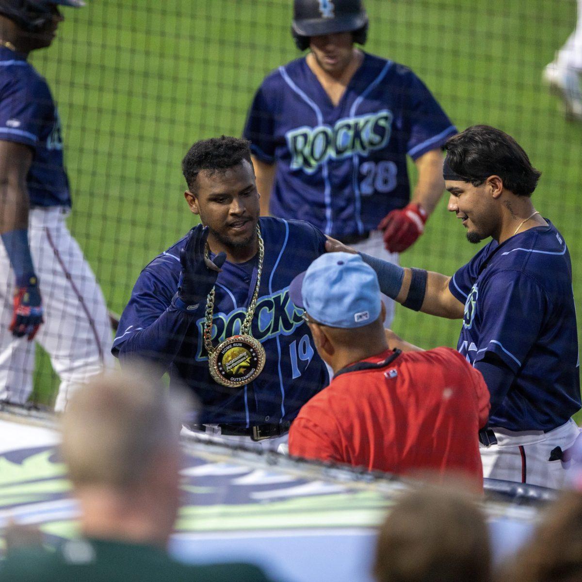 Israel Pindea is celebrated by the dugout following his two-run home run. Tuesday, August 1, 2023. - Staff Photographer / Joe Capuyan