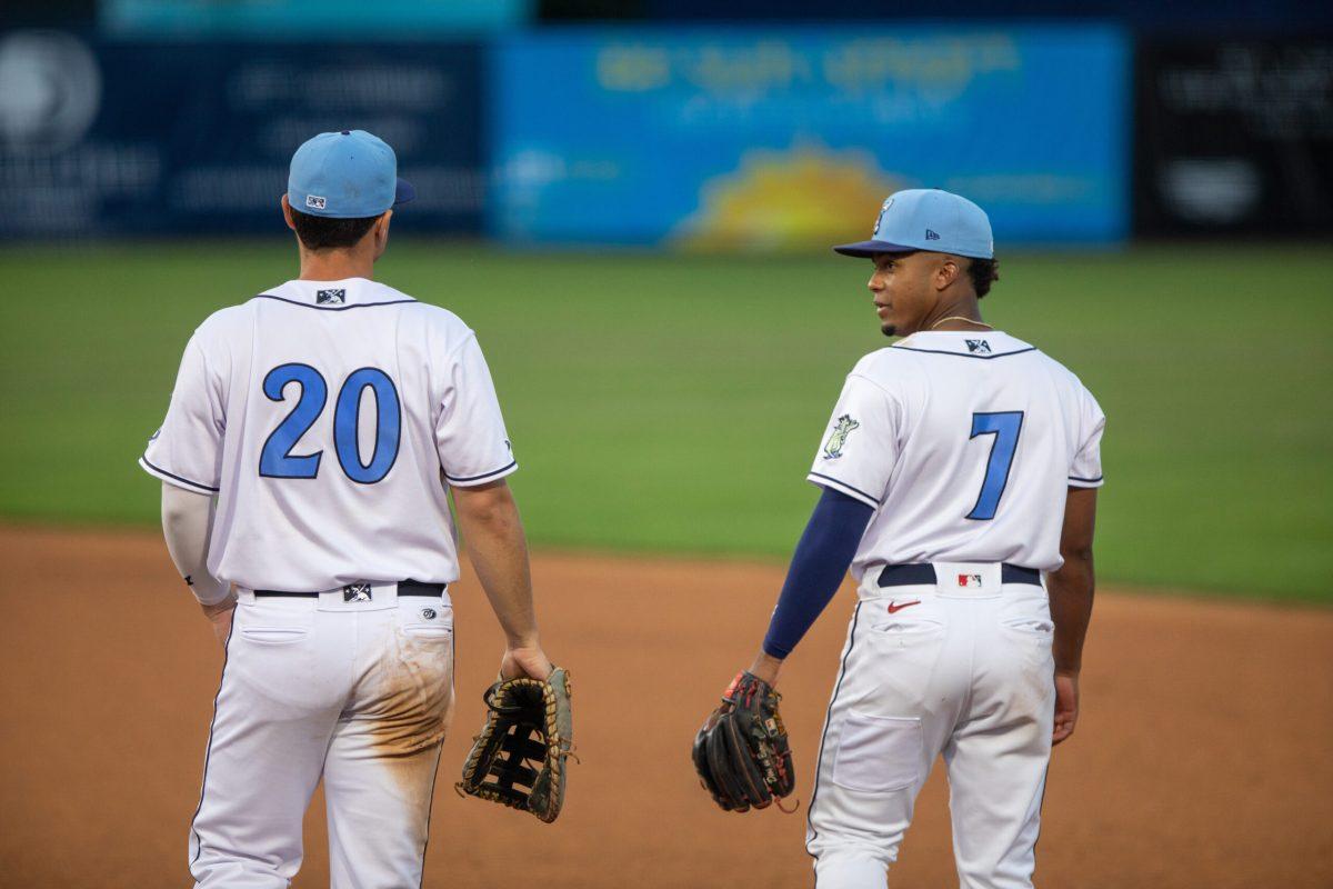 First basemen Brandon Boissiere and second-basemen Viandel Pena communicating on the diamond. Wednesday, August 2, 2023. - Staff Photographer / Joe Capuyan