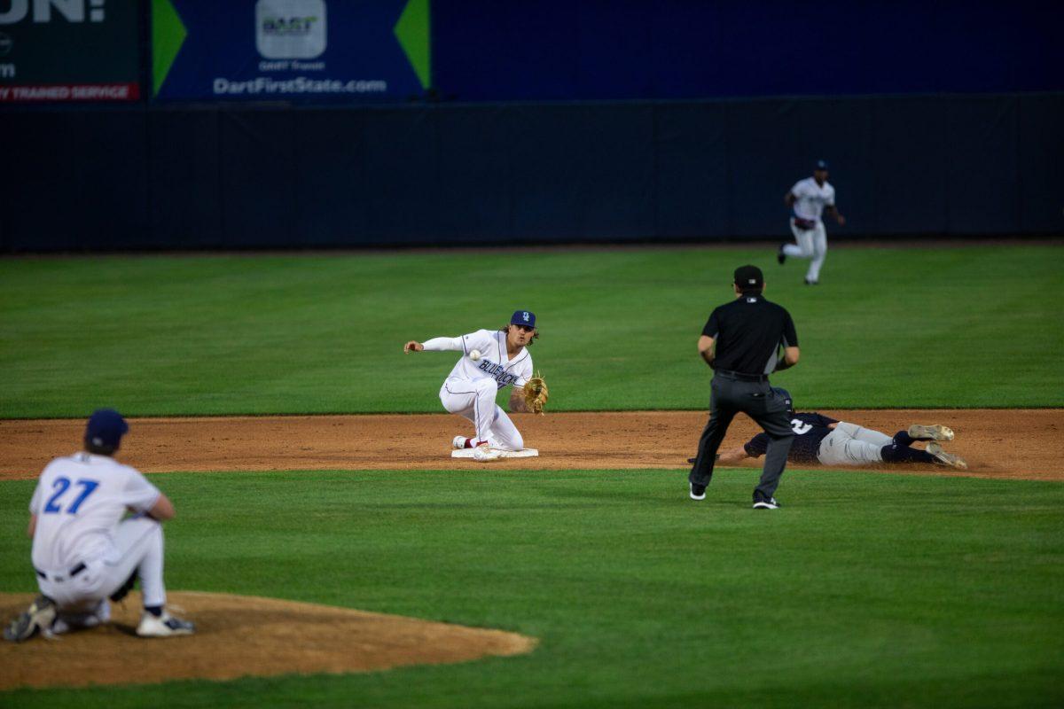 Cortland Lawson collects the throw and applies the tag in his Blue Rocks debut. Thursday, August 3, 2023. - Staff Photographer / Joe Capuyan