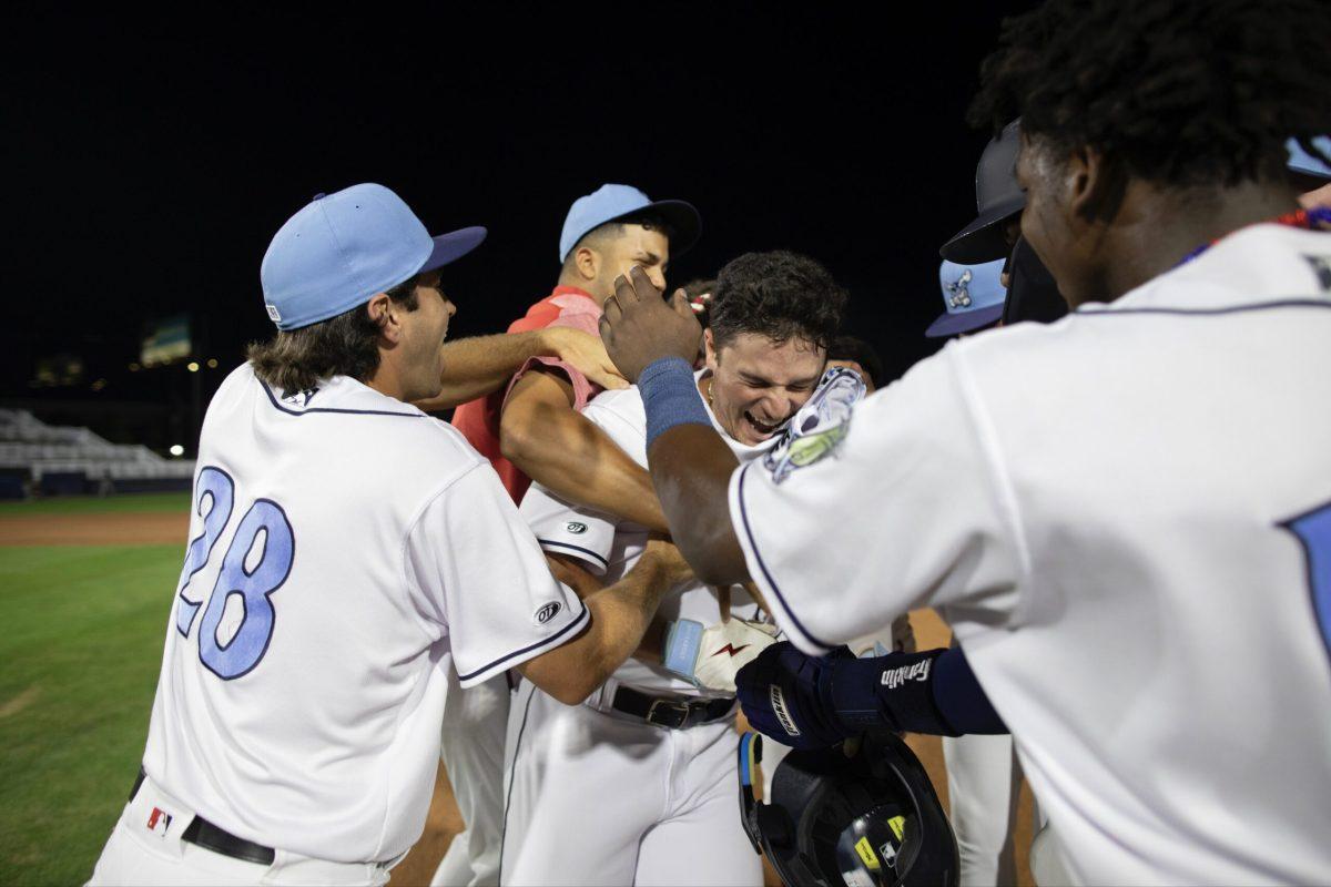 Brandon Boissiere gets mobbed by teammates following his walk off hit. Saturday, August 6, 2023. - Photo via @WilmBlueRocks on Twitter.