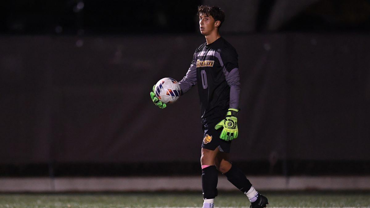 Dylan Aportela looks to pass the ball. Aportela had seven saves during Rowan's tie against Cortland. - Photo / Rowan Athletics