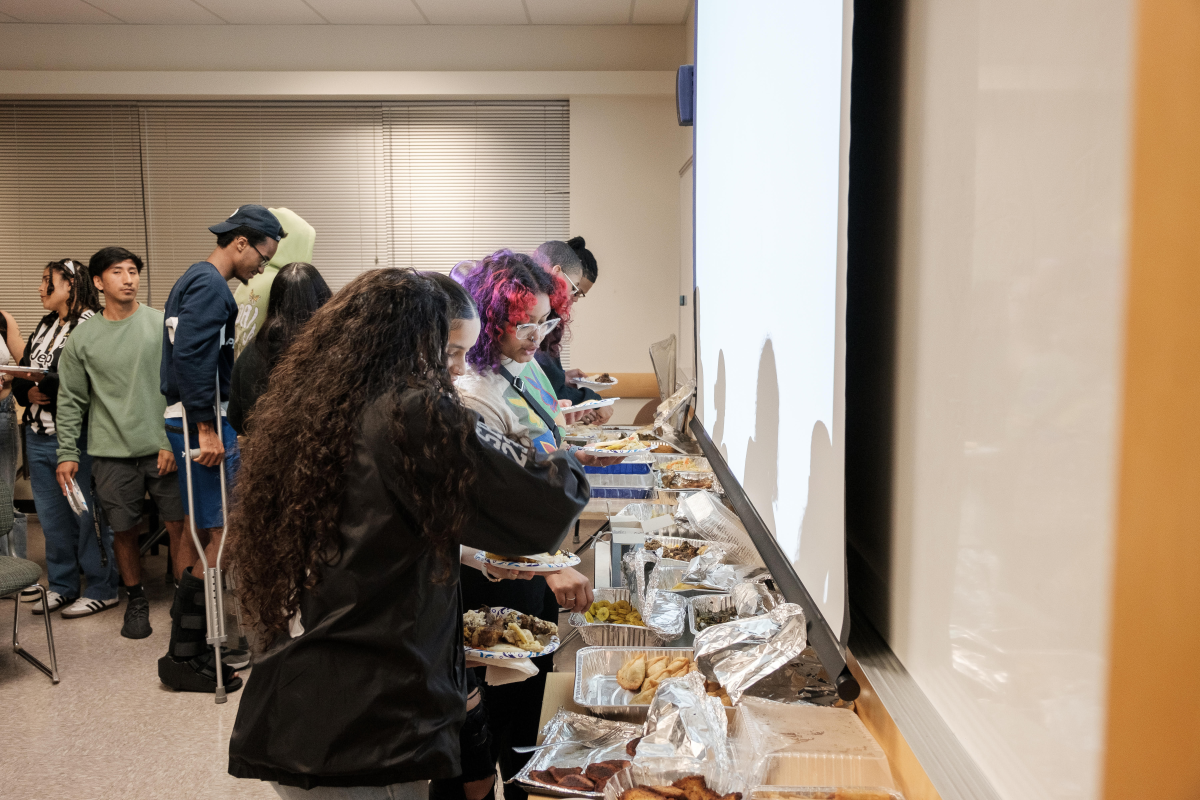 Students pick their food from the buffet line-up. Photo via Joshua Olumakin