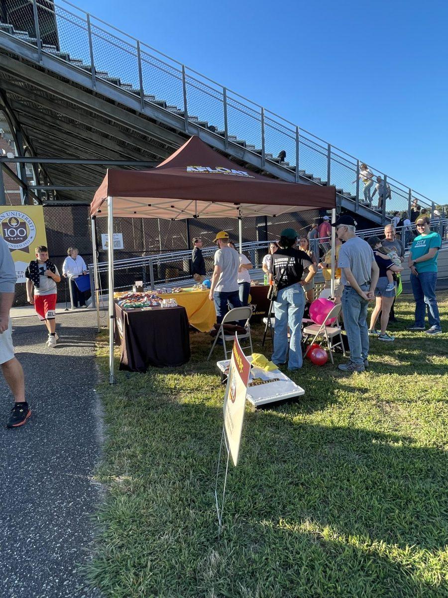 A tailgate tent hands out giveaway items and information on resources for students. - Contributor / Sarah Shockey