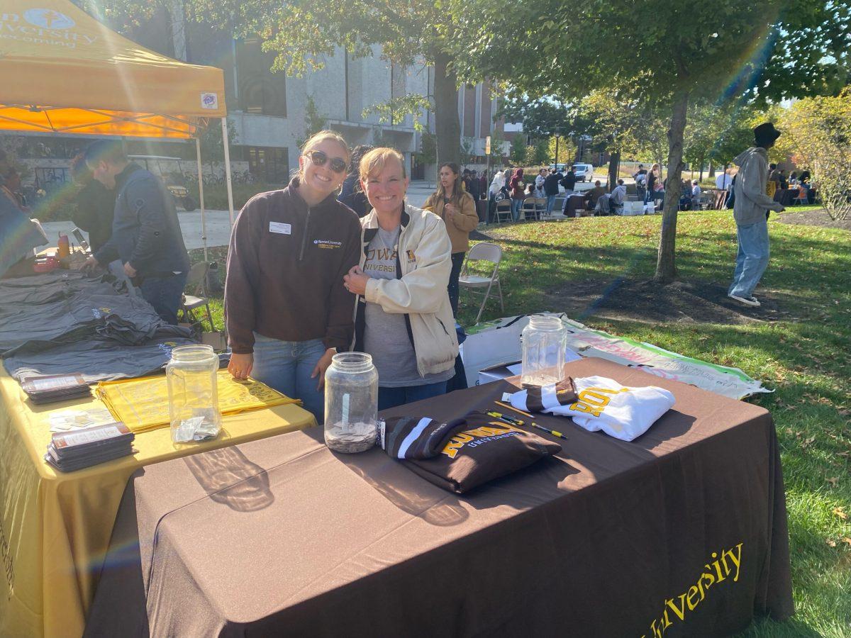 University staff Ashley Davis and Karen Teller help check students in and facilitate sweatshirt raffle. - Co-News Editor / Madison Miller