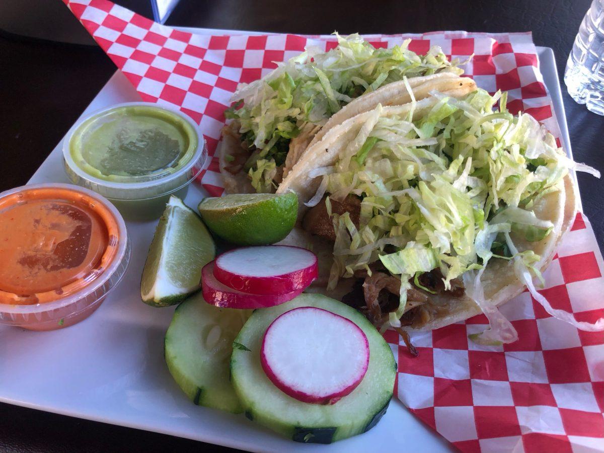 An order of one chicken taco and one carnitas (pulled pork) taco. - Staff Writer / Jose Ascencio