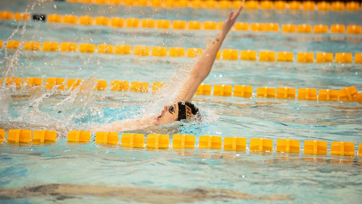 Jack Watson competes in the backstroke. Watson got off to a hot start in the Profs' first meet, taking first place in three events. - Photo via Rowan Athletics