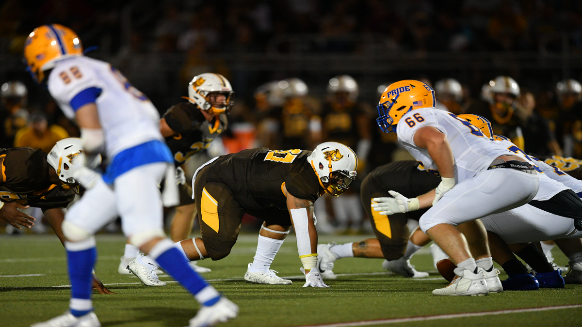 Josh Ortiz lines up before a play. Ortiz recorded nine tackles against Christopher Newport. - Photo via Rowan Athletics