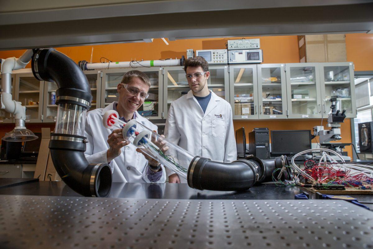 Dr. Trkov (left) is depicted at the lab working on a soft robot, the robotics project was led by Dr. Xue and Dr. Trkov. - Contributor / Kevin Monko