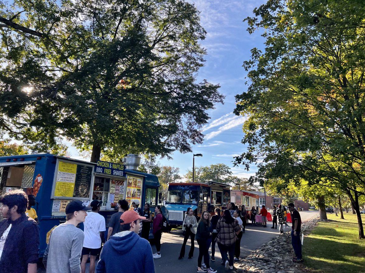 Students line up at food trucks. - Staff Writer / Isaac Link