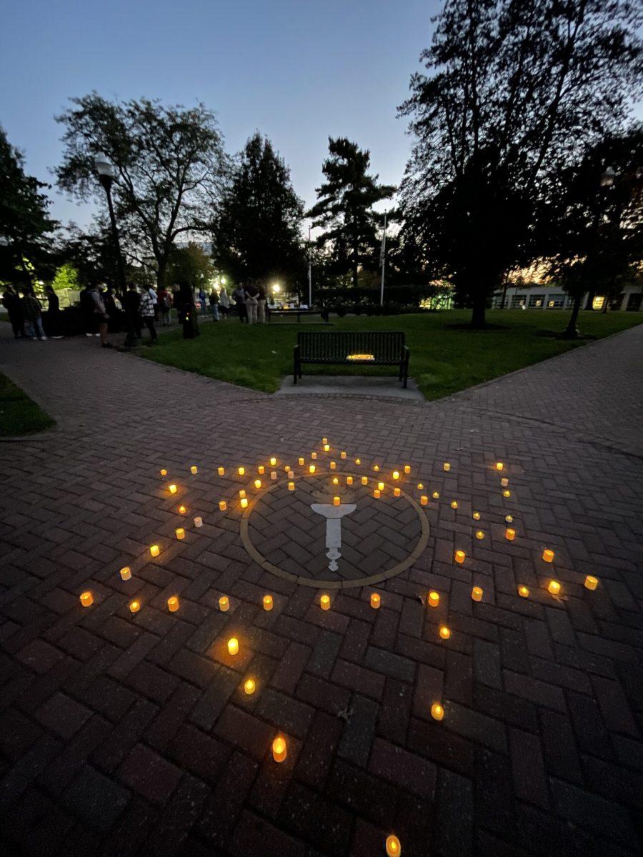 Students created the Star of David out of candles over the Rowan torch seal in support of the lives that have been lost to acts of terrorism. - Co-News Editor / Gianna Malgieri