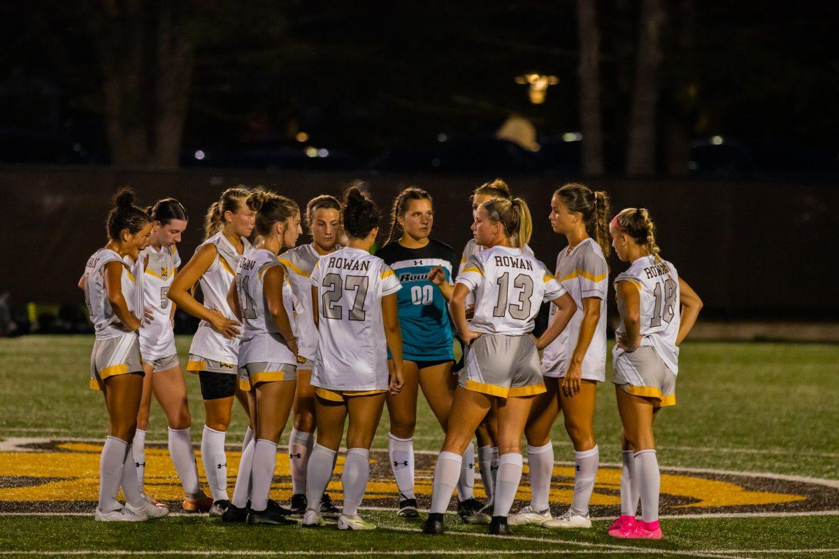 Rowan women's soccer huddles during a stoppage of play. The team is 7-0-1 in conference play. - Wednesday, Sept. 13, 2023. - Photo via Lee Kotzen