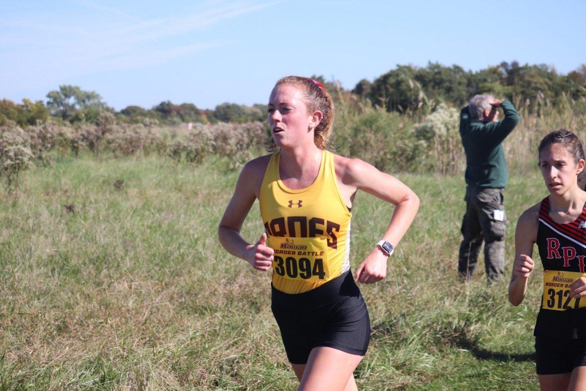 Cammy Wright runs in a race. Wright helped the Profs secure a fourth-place finish during the Metro Regional Championships. - Photo via Rowan Athletics