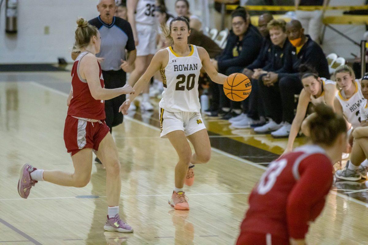 Kate Herlihy brings the ball up the court. Herlihy finished with a game-high 22 points. - Wednesday, Feb. 15, 2023. - Photo via Lee Kotzen