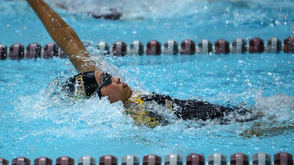 Trisha Lau competes in the backstroke. Head coach Brad Green noted Lau's improvement in the team's latest meet. - Photo via Rowan Athletics