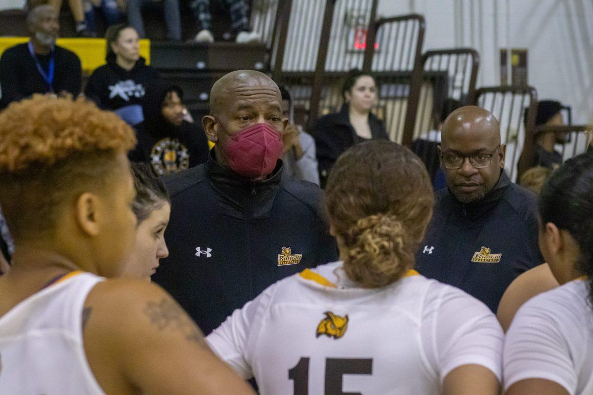 Demetrius Poles talks to the team during a timeout. Throughout his time as head coach, the women's basketball team won two NJAC Championships. - Saturday, Dec. 3, 2022. - Photo via Lee Kotzen