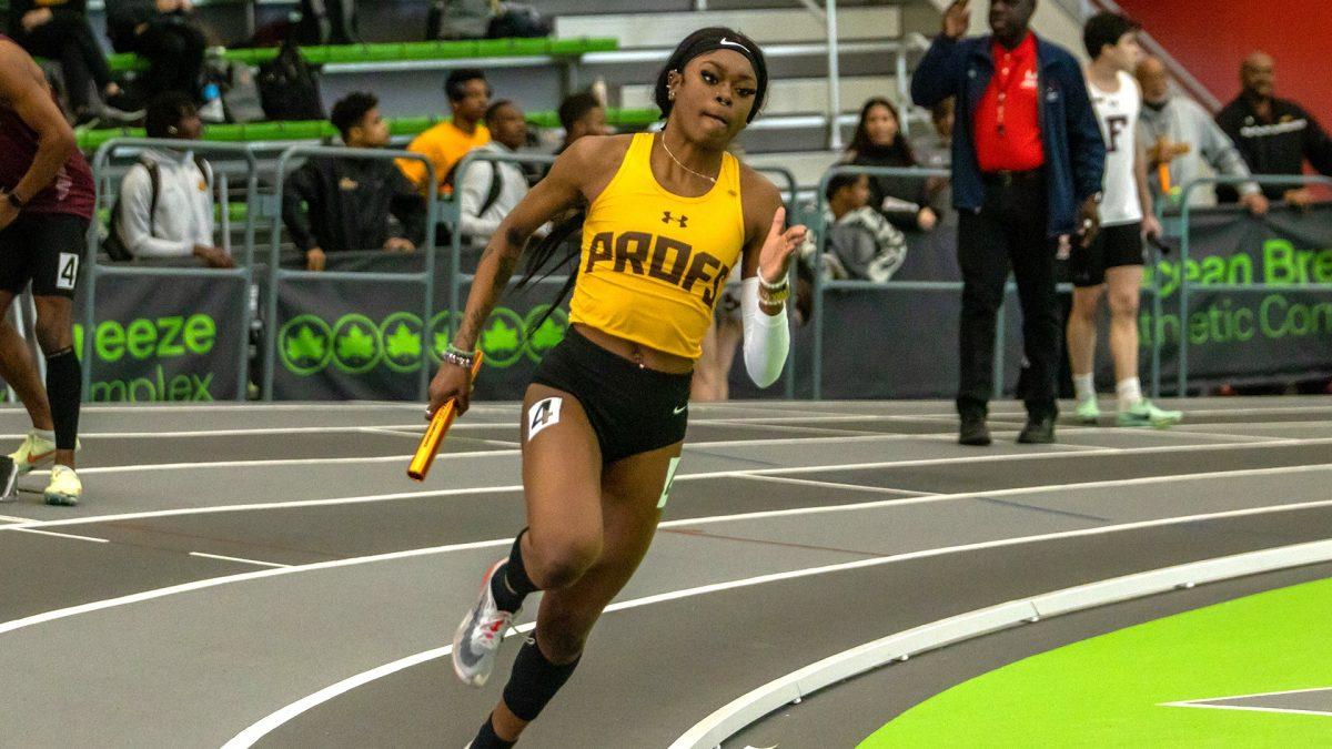 Nevaeh Lorjuste sprints to the finish line. Lorjuste finished first in the 400 meter during the FastTrack Season Opener. - Photo via Rowan Athletics