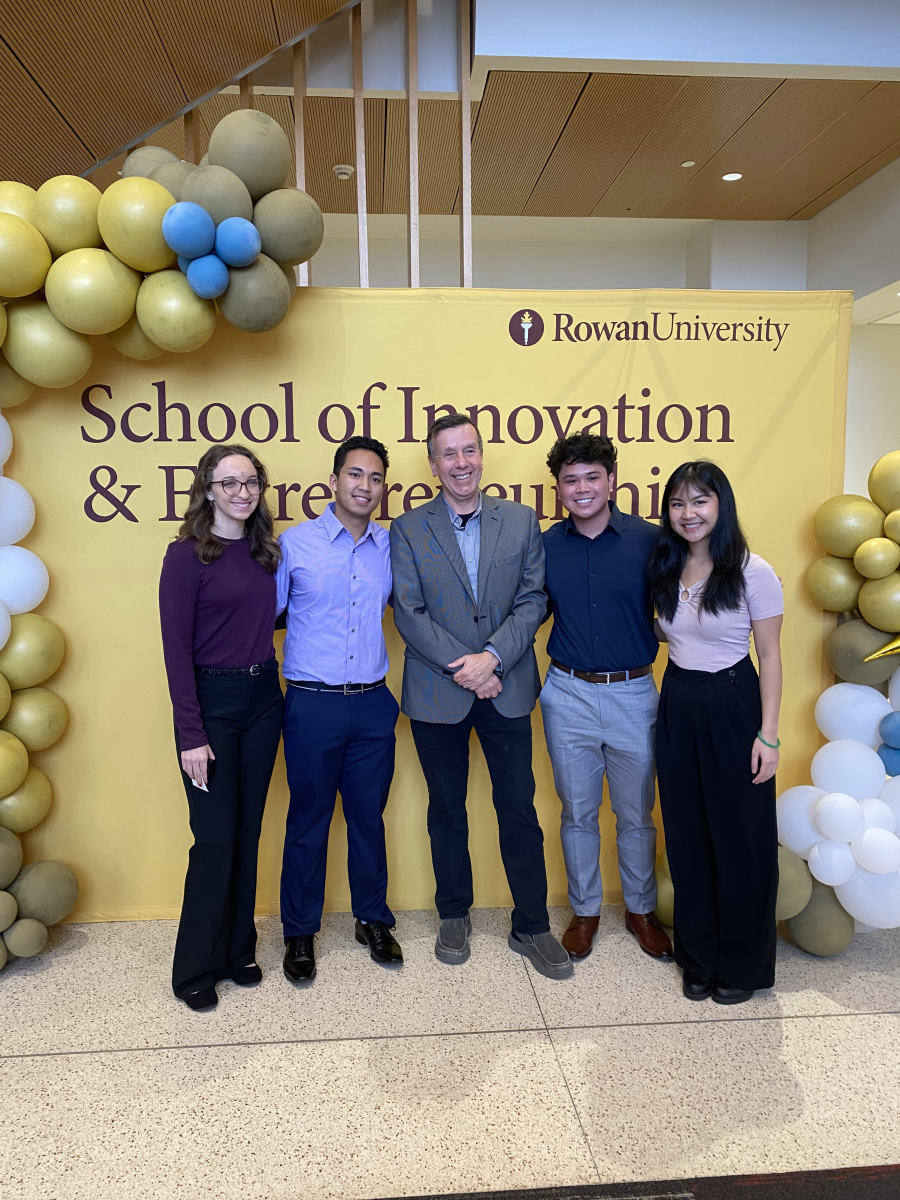 Rowan's fifth cohort of University Innovation Fellows stand with advisor Dr. Michael Dominik after their induction. - Co-News Editor / Madison Miller