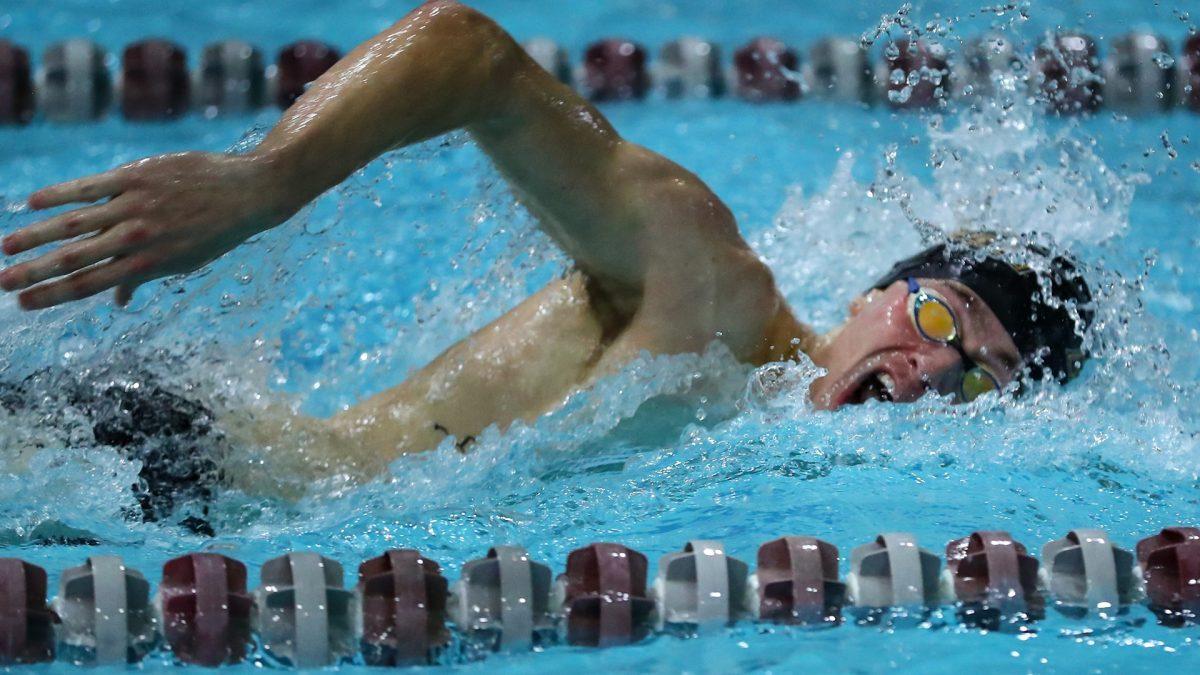 Jack Watson participates in a race. Watson finished first in the 100-yard backstroke on Saturday, Jan. 27 while recording a season-best time. - Photo via Rowan Athletics