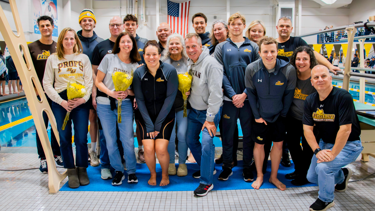 Sara Clayton (center) gets honored by her family, coaches, and part of the men's team before the meet. Clayton was the team's lone senior. - Photo via Rowan Athletics