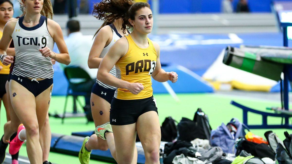 Anna Sasse runs in a race. Sasse was the anchor of the distance medley relay that is nearly top 10 in all of Division III. - Photo via Rowan Athletics