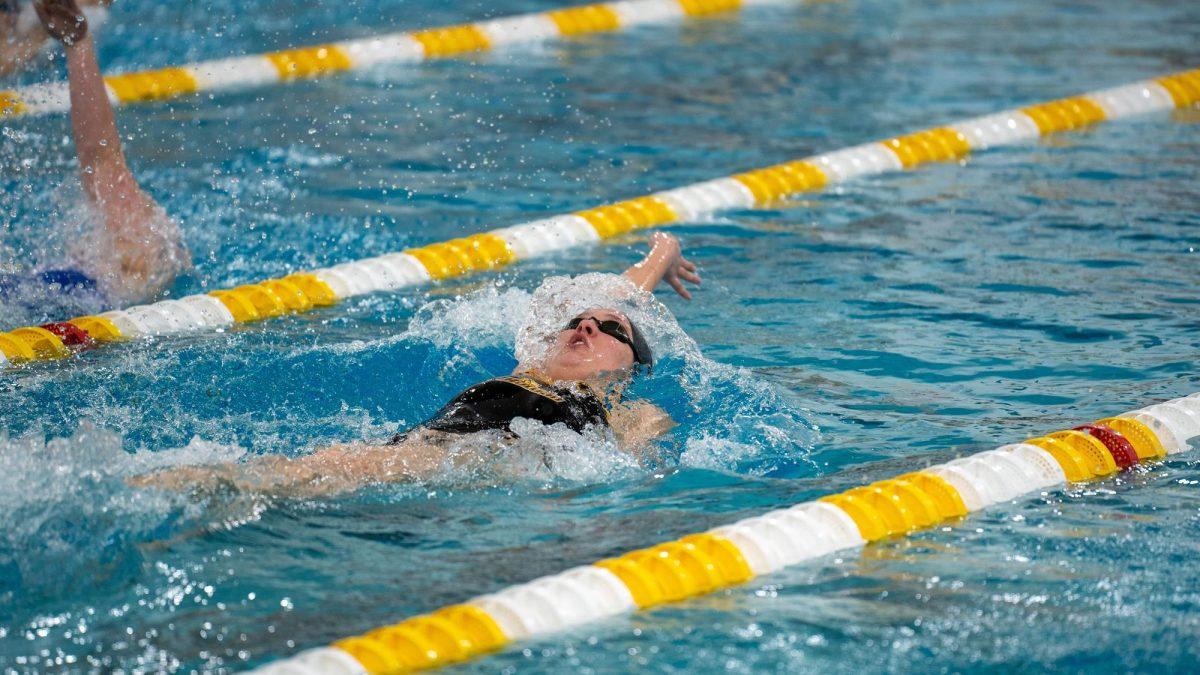 Sara Clayton swims in a race. Clayton is one of the many members of the team confident entering the NJACs. - Photo via Rowan Athletics