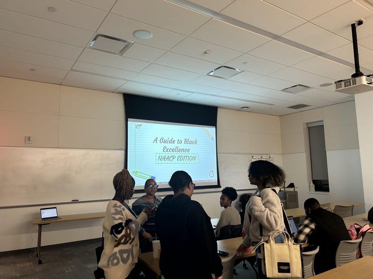 Students attending "A Guide to Black Excellence" settle into their seats. - Staff Writer / Maryela  Gallardo