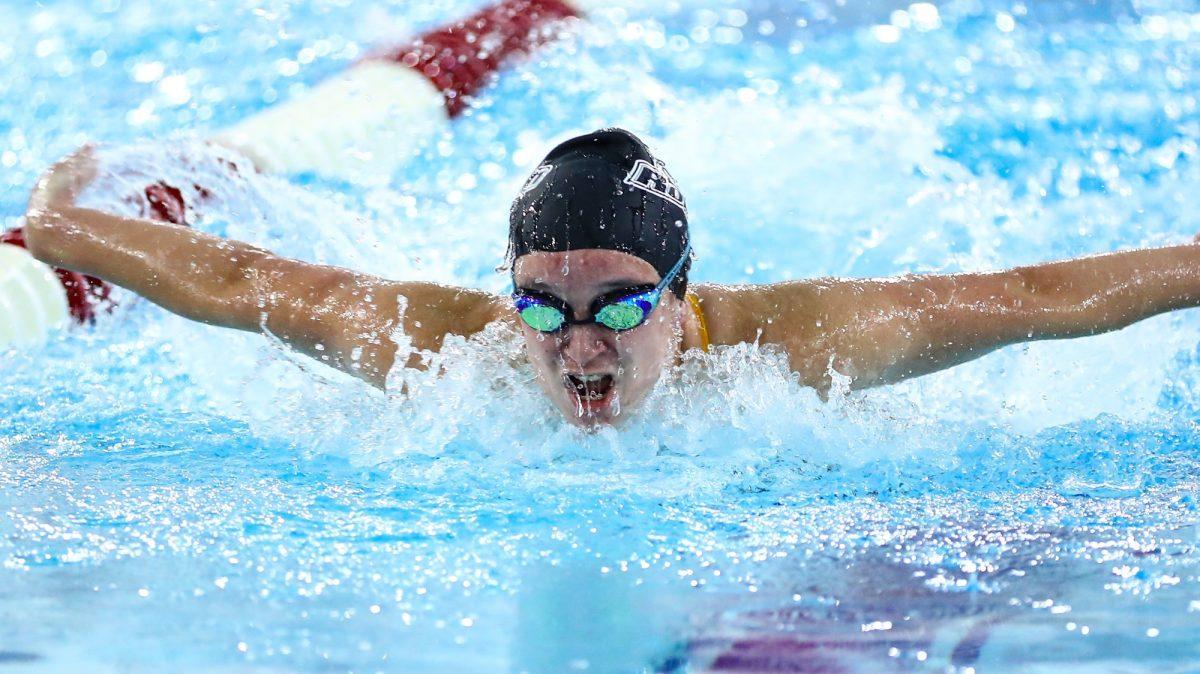 Ella Pennington swims in a race. The sophomore broke her own school record in the 200 backstroke during the NJAC Championships. - Photo via Rowan Athletics