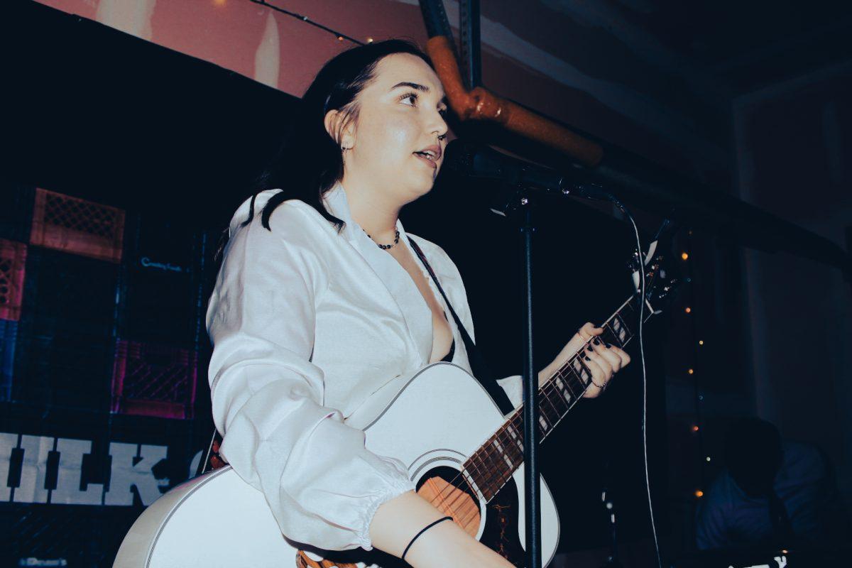 Steinert performs at The Milk Crate's Halloween concert which was the venue first show that she runs with her roommates. - Arts & Entertainment Editor / Al Harmon