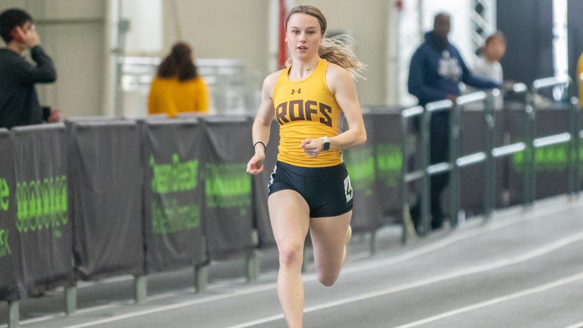 Kat Pedersen runs in a race. Pedersen was a part of the 4x200 relay that broke the school record. - Photo via Rowan Athletics