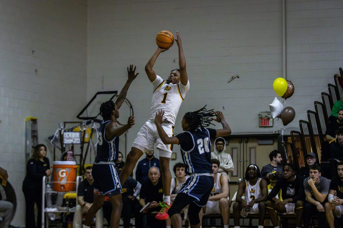 Ja'Zere Noel rises over two defenders for a mid range jumper. Noel recorded a double-double in the win over NJCU. - Saturday, Feb. 3, 2024. - Photo via Lee Kotzen