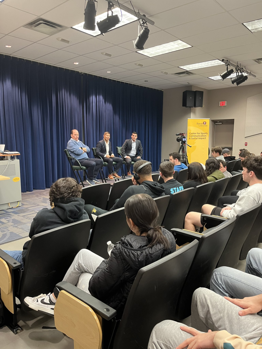 Neil Hartman, Eric Poe, and Brandon Rost speak at Pizza with the Pros. - Photo via RowanSportsCAM on X