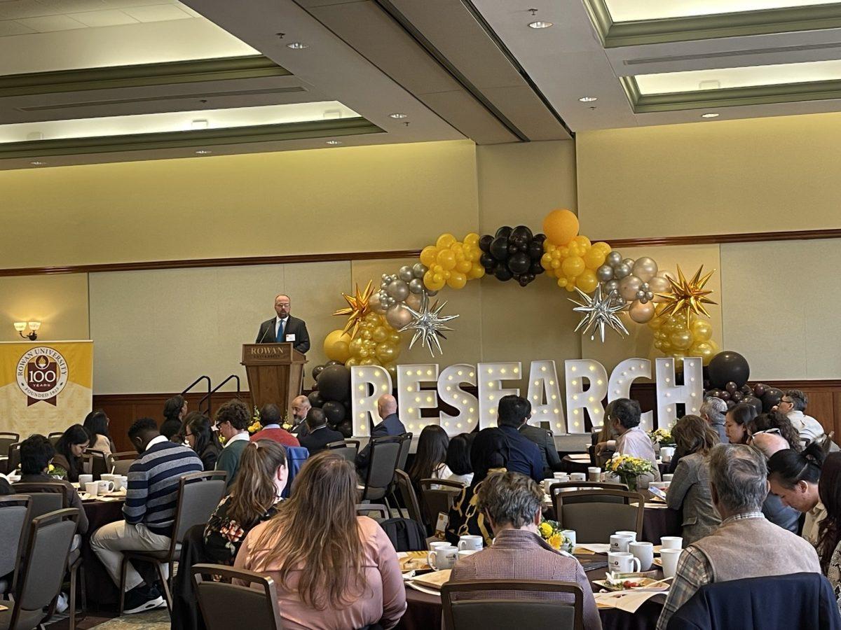 Guest speaker Chris Whitehead gives his speech to faculty, current students, and postgraduates at Rowan Research Day. - Staff Writer / Marchella Mazzoni