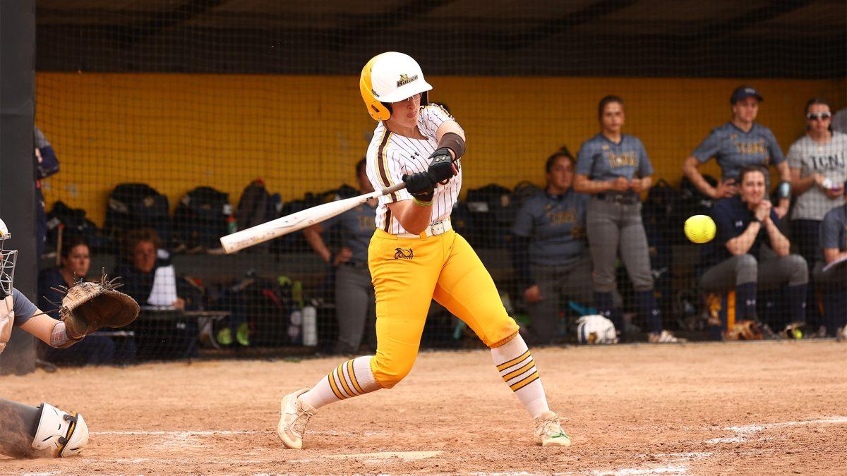 Kaitlyn Riggs swings at a pitch. Riggs is the new starting catcher for Rowan. - Photo via Rowan Athletics