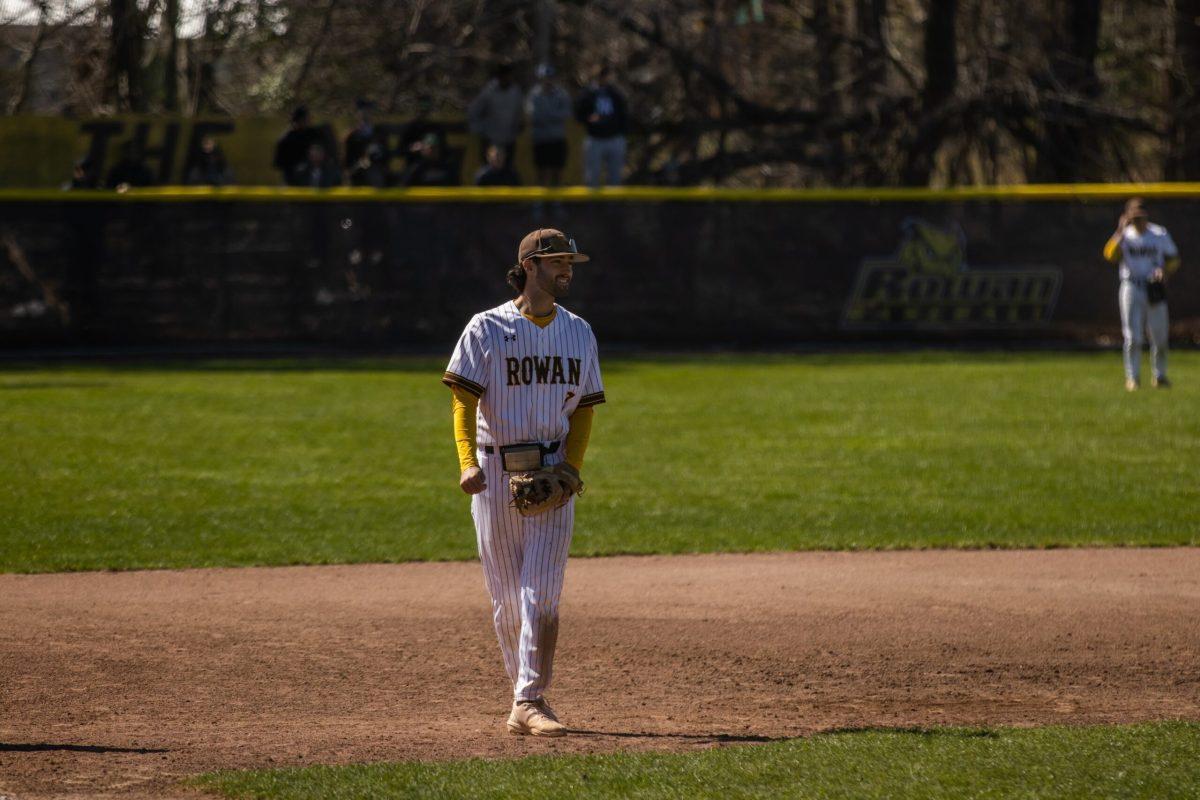 Anthony Schooley smiles after an out. Schooley is in his final year with the Profs. - Sunday, April 2, 2023. - Photo via Lee Kotzen