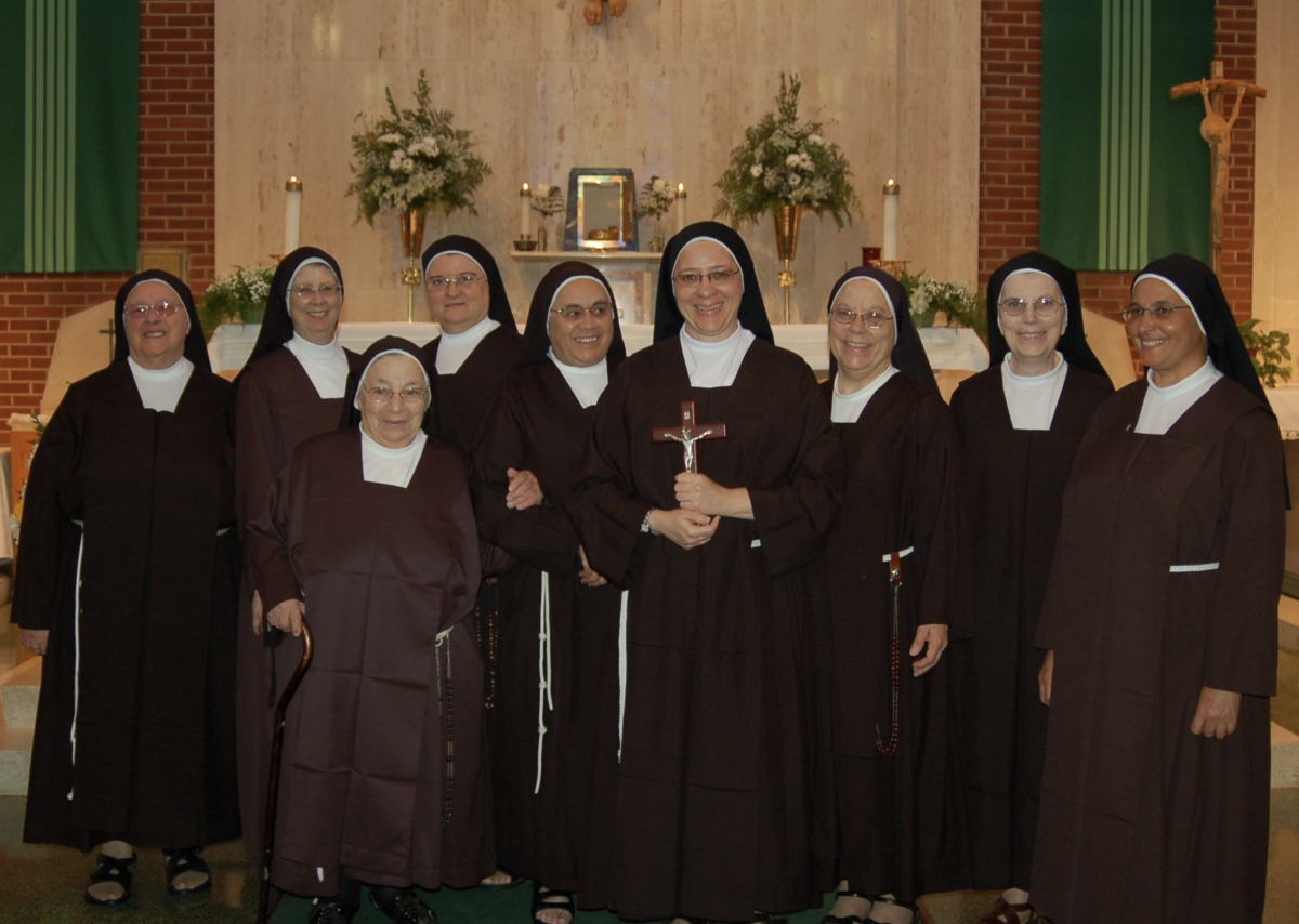 Sister Stacie Gagnon poses for a photo along side fellow Catholic sisters. - Photo via Sistersfmihm.org