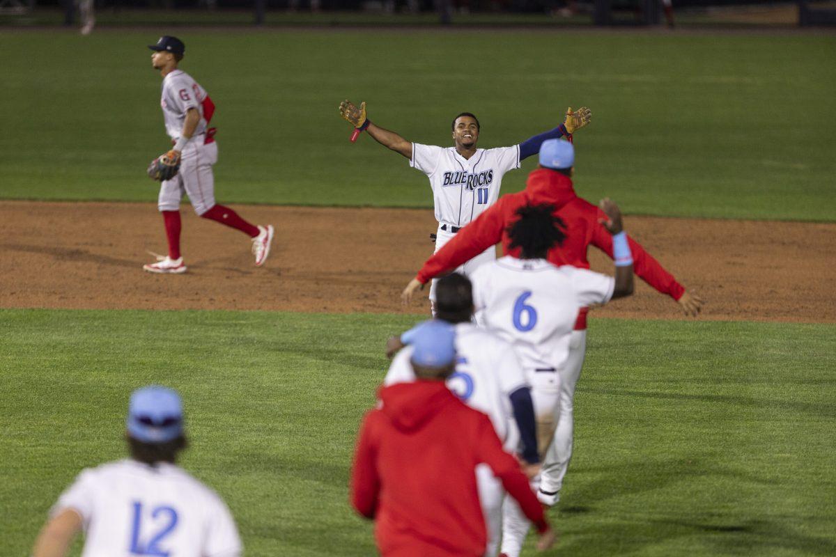 The Blue Rocks swarm Viandel Pena after his walk-off hit against the Drive. - Tuesday, April 16, 2024 / Photo via Ryan Griffith