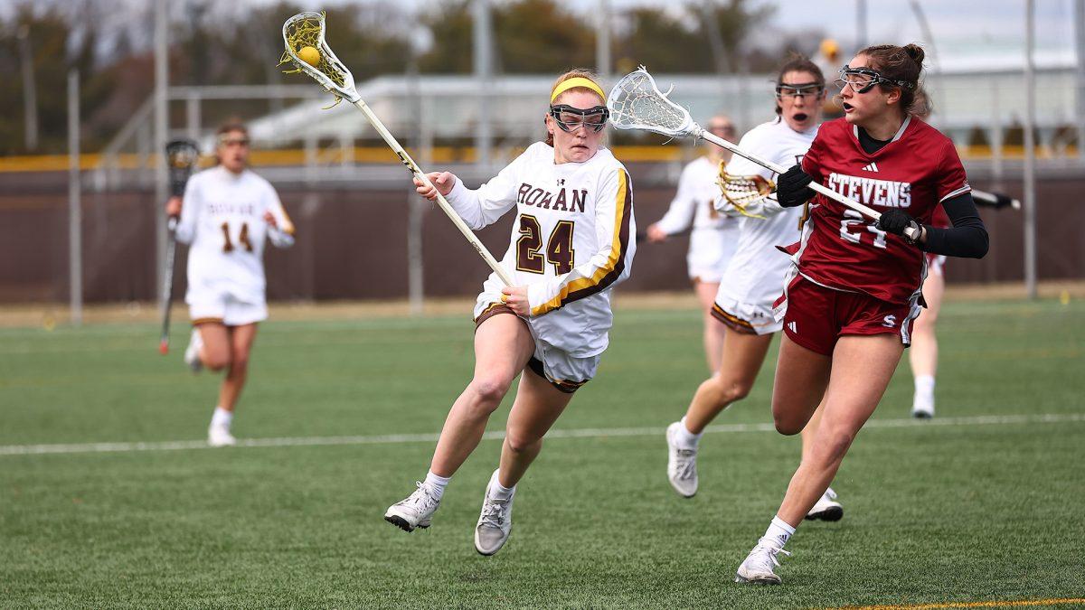 Molly Green attacks the defense. Green recorded five of the team's 11 goals on Saturday. - Photo via Rowan Athletics