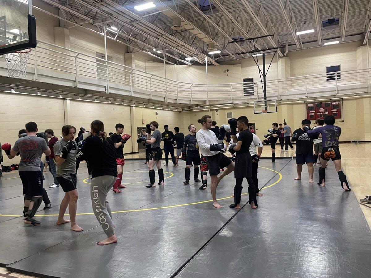 Rowan MMA club practicing drills with partners and Fazen. - Staff Writer / Marchella Mazzoni