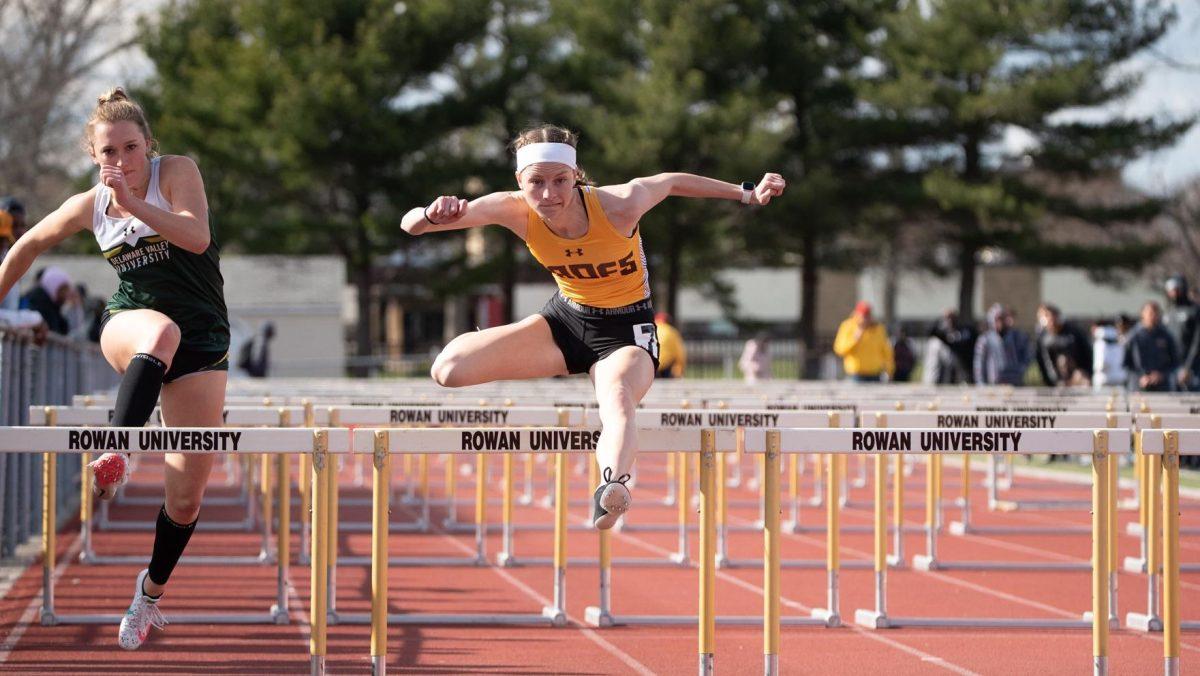 Molly Lodge runs in the hurdles event. Lodge recorded the top NJAC time in the 400 meter hurdle at the Larry Ellis Invitational. - Photo via Rowan Athletics