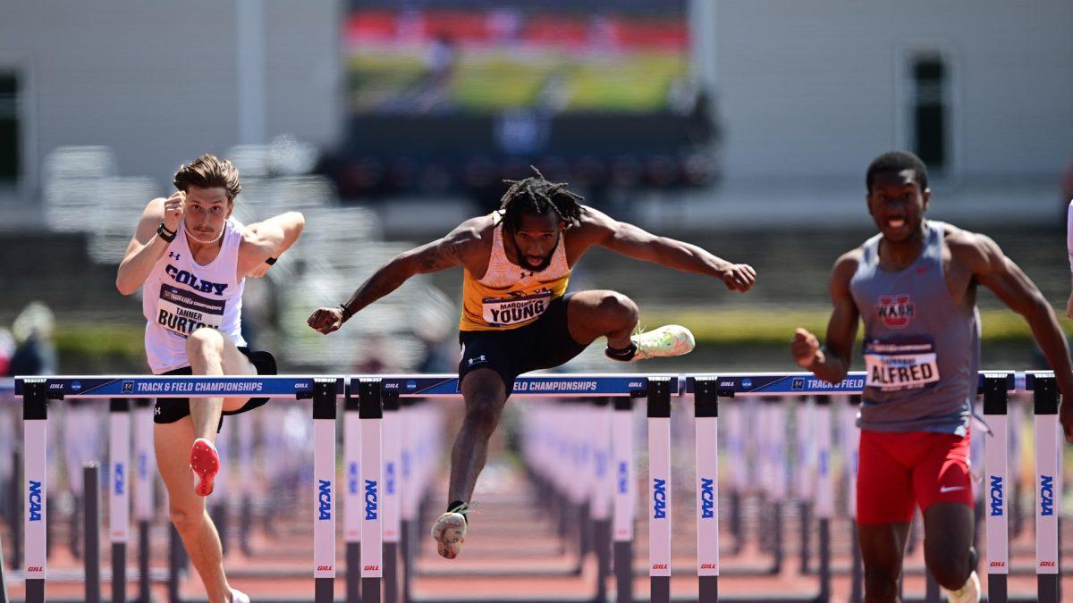 Marquise Young competes in a hurdles event. Young recorded a first place finish in the 110 meter hurdle. - Photo via Rowan Athletics