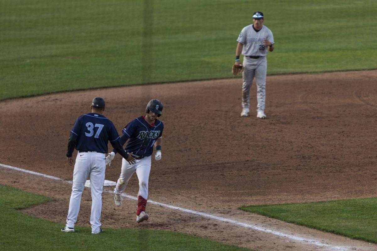 Paul Witt high-fives manager Mario Lisson after hitting a home run. Witt went 2-3 with 2 RBI in the Blue Rocks win on Thursday. - Thursday, May 2, 2024 / Photo via Ryan Griffith