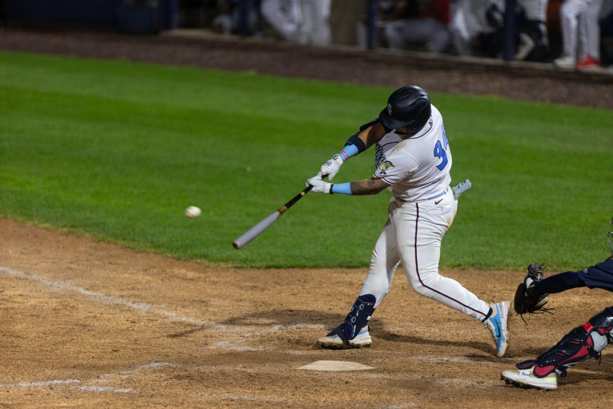 Maxwell Romero Jr. swings at the pitch. Romero walked it off against the Cyclones with an RBI single into right-center field. - Friday, July 12, 2024. / Photo via Ryan Griffith