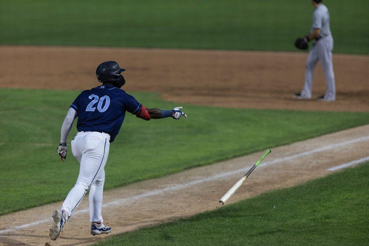 T.J. White flips the bat. White hit the go-ahead home run on Tuesday. Tuesday, July 23, 2024. / Photo via Ryan Griffith