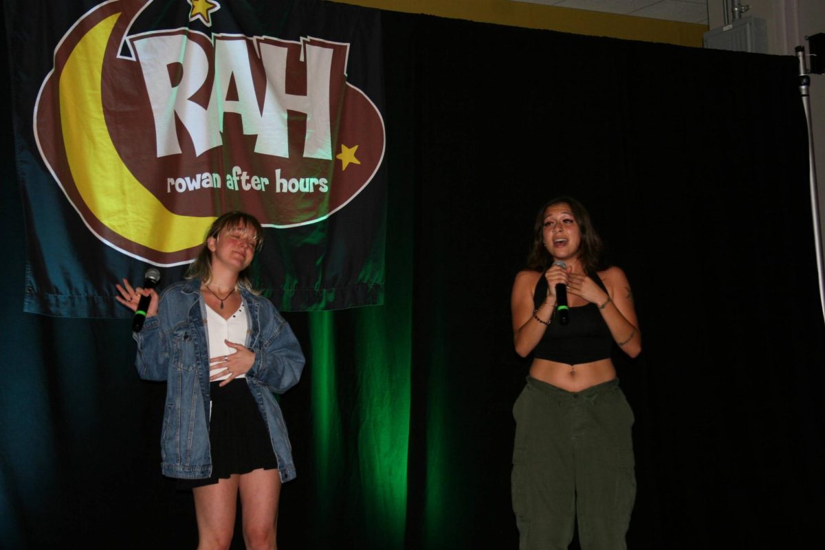 Rebecca Mendoza (left) and Madyson Pellegrino (right) sing "Let It Go" from Frozen (2013) at Rowan After Hours' Disney Karaoke Night. Glassboro, NJ. Saturday, September 21, 2024. - Staff Photographer / Luca Voight-Williams