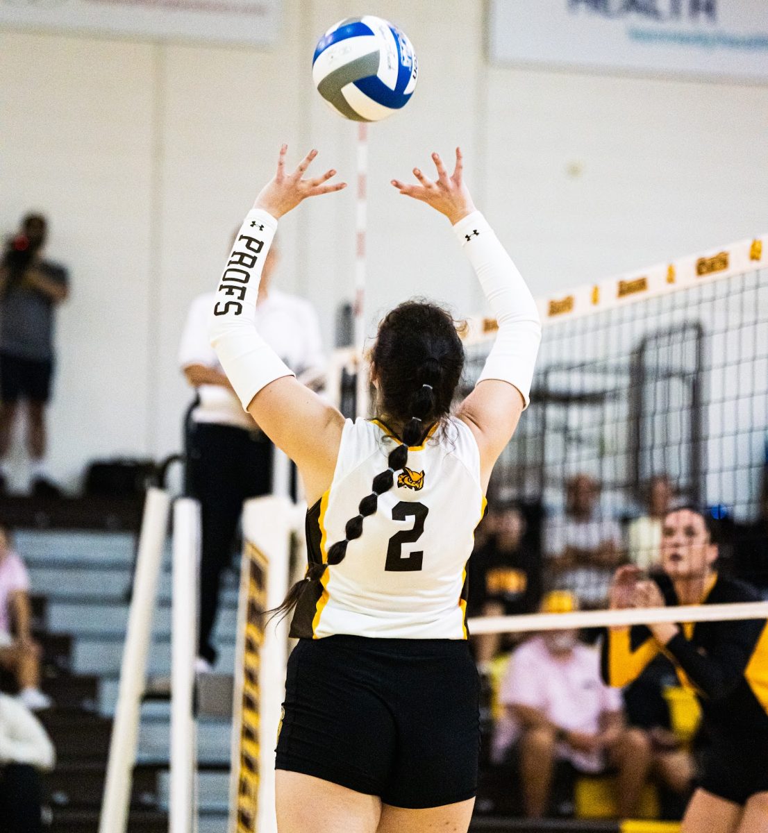 Brooke Adams setting up her teammate. The senior tallied 26 assists in the Profs' loss to Stockton. - Contributor / David Picariello