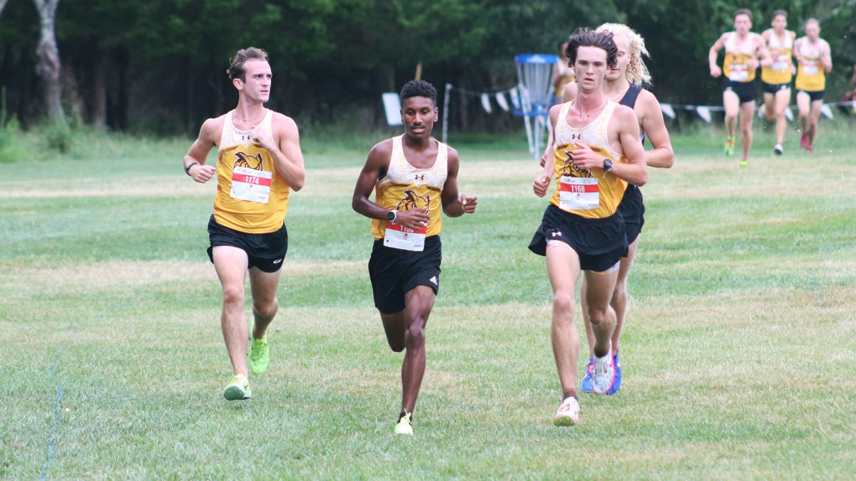 Joshua Cason (middle) hustles to the finish line. Cason has established himself as a standout runner for Rowan men's cross country. - Photo via Rowan Athletics