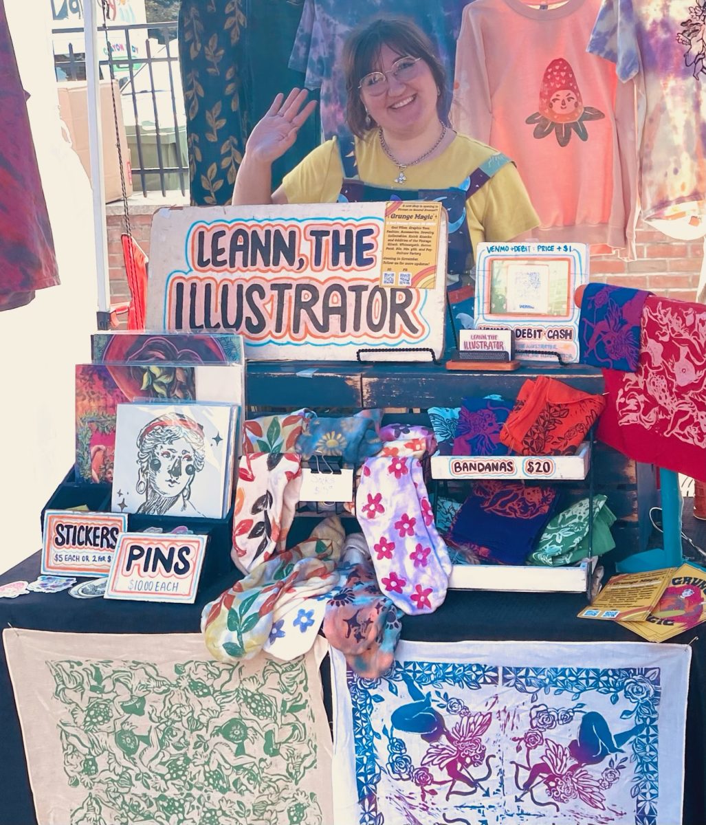 Leann, a Rowan alumni, selling her hand designed and printed clothes, stickers, and prints. - Staff Writer / Lily Miller