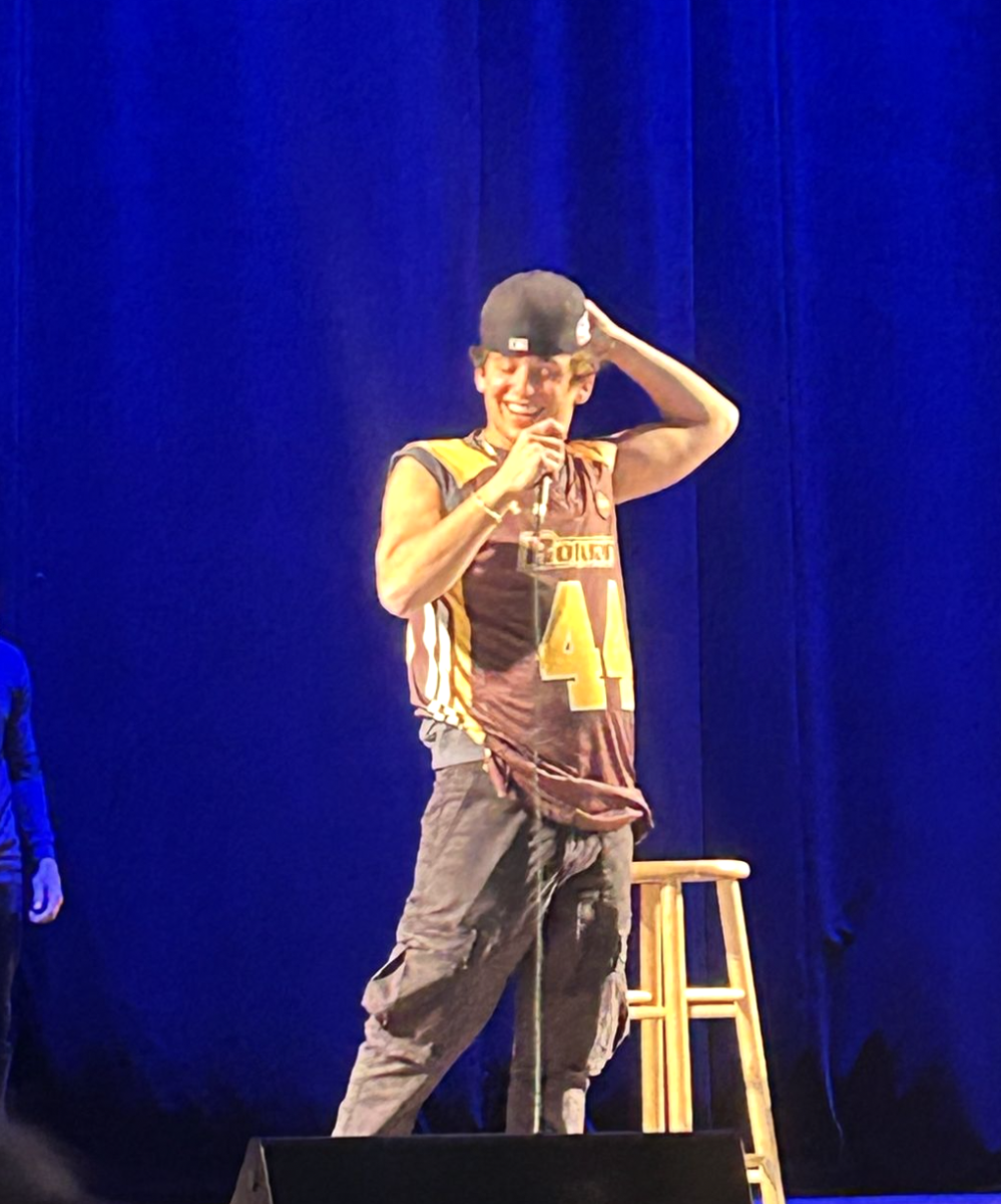 Marcello Hernandez wears Rowan jersey at comedy show event. - Photo via @barstool_rowan on Instagram