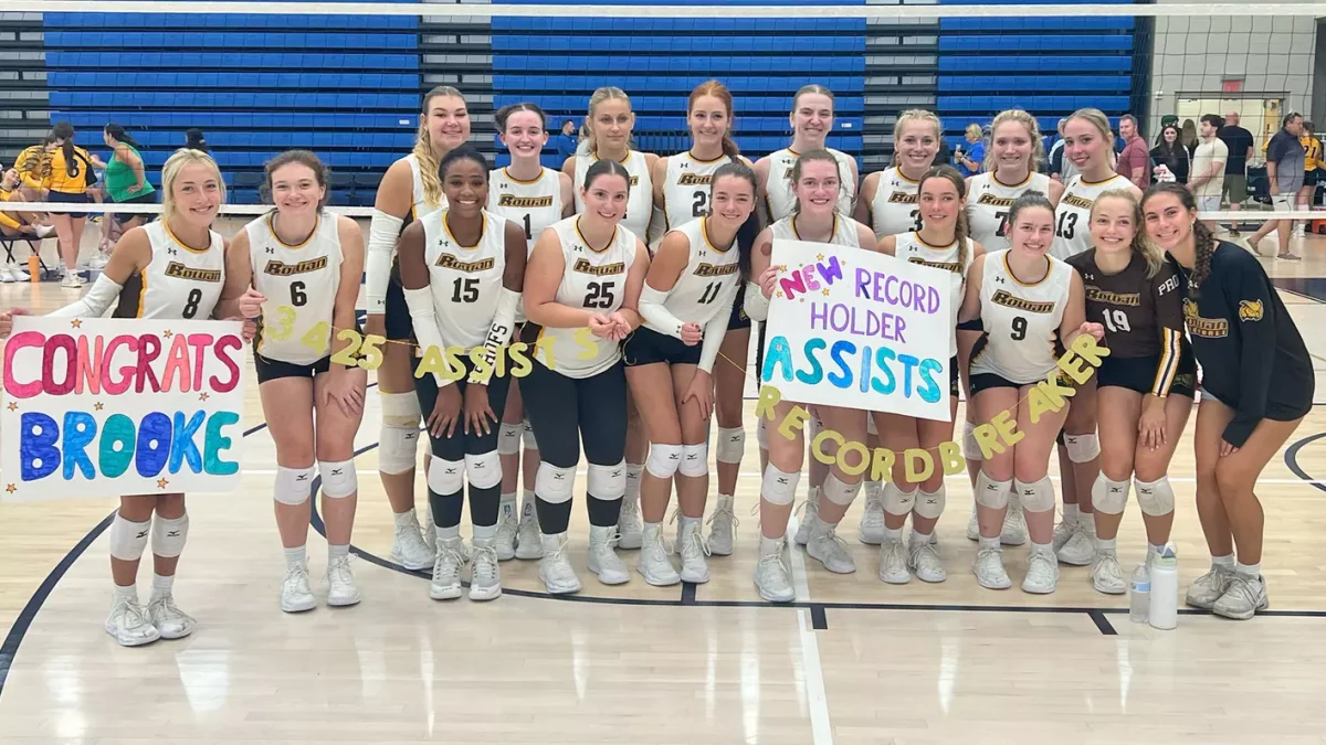 The team celebrates Brooke Adams accomplishment. Adams became the program's all-time assist leader on Saturday against Ursinus. - Photo via Rowan Athletics