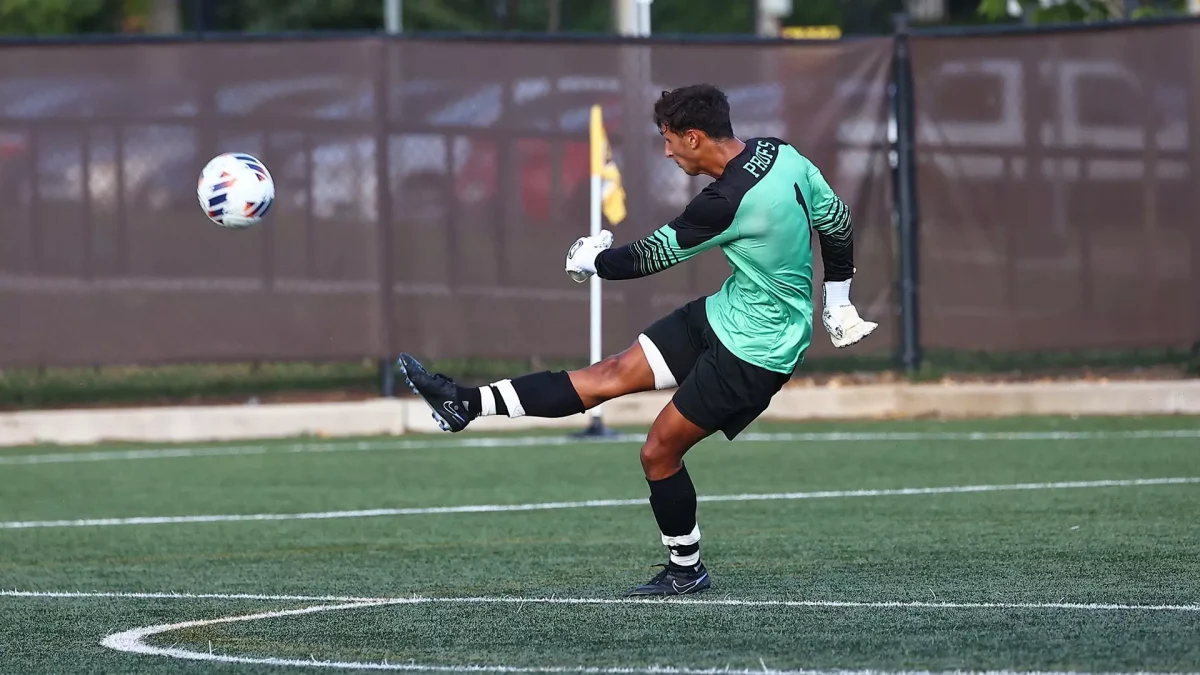 Dylan Aportela kicks the ball away from the net. Aportela recorded nine saves across the two games. - Photo via Rowan Athletics